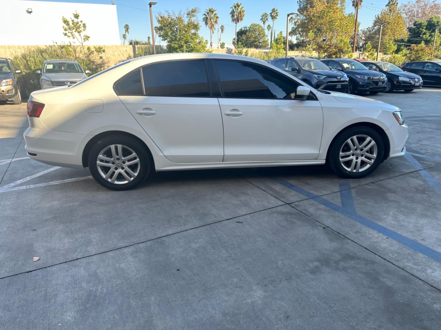 2018 WHITE /BLACK Volkswagen Jetta 1.4T S 6A (3VW2B7AJ9JM) with an 1.4L L4 DOHC 20V engine, 6A transmission, located at 30 S. Berkeley Avenue, Pasadena, CA, 91107, (626) 248-7567, 34.145447, -118.109398 - Crown City Motors is a used “Buy Here Pay Here” car dealer in Pasadena CA. “Buy Here Pay Here” financing, means that when you purchase your vehicle from our dealership, that you make the payments to the dealership as well. We do not need the banks approval to get you approved for a used auto - Photo#5